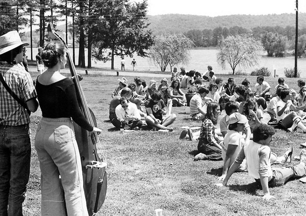 Vintage photo of students on quad listening to live band